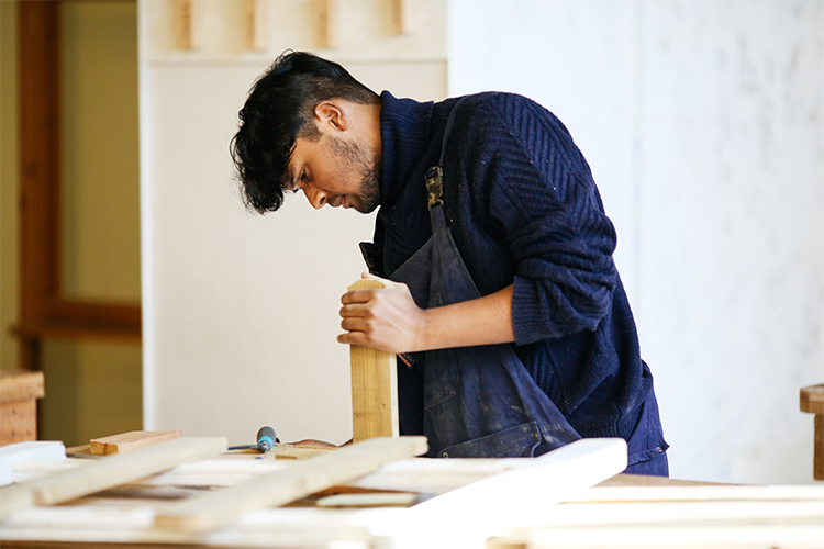 Student in a carpentry workshop