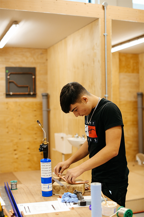 Student working with pipes