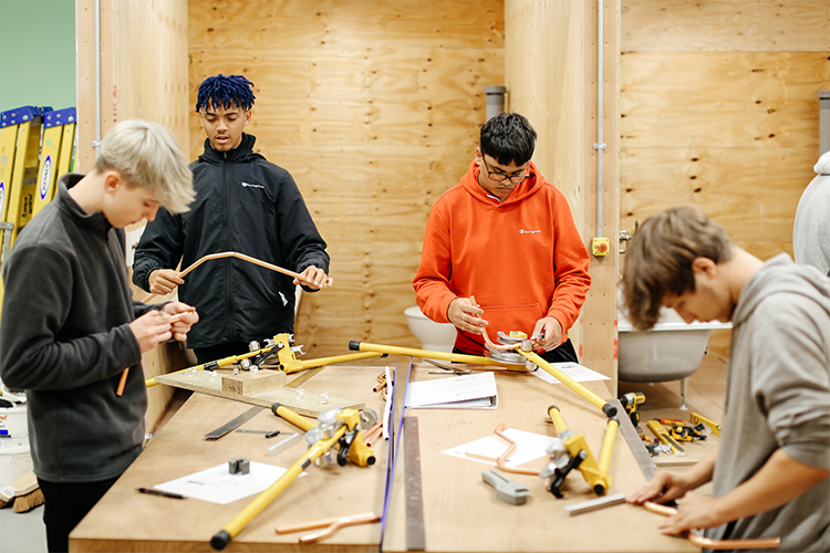 Group of students working on their pipes