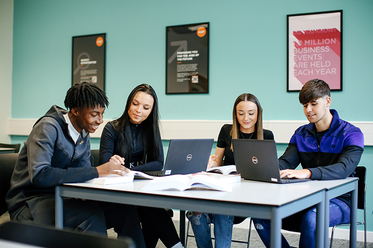 students looking at laptops