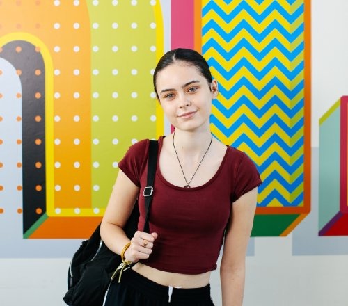 Student smiling facing camera