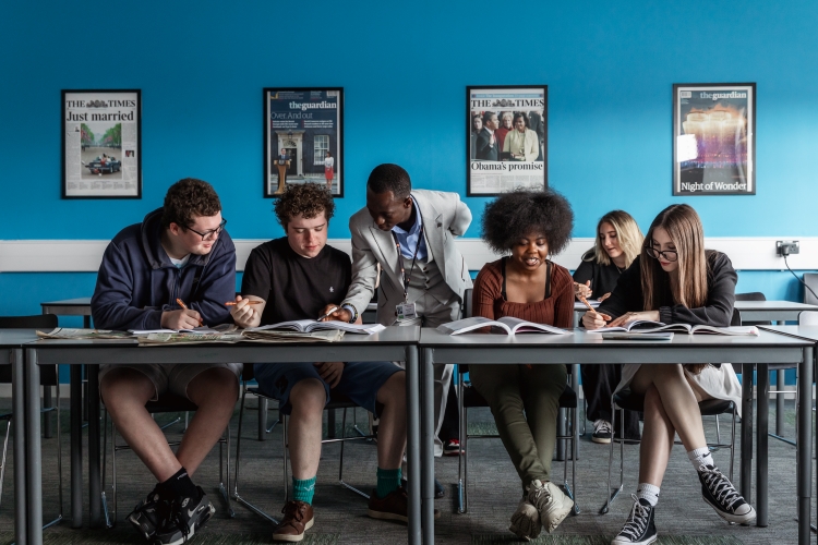 Students looking at books
