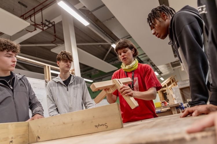 Students working together on a carpentry project