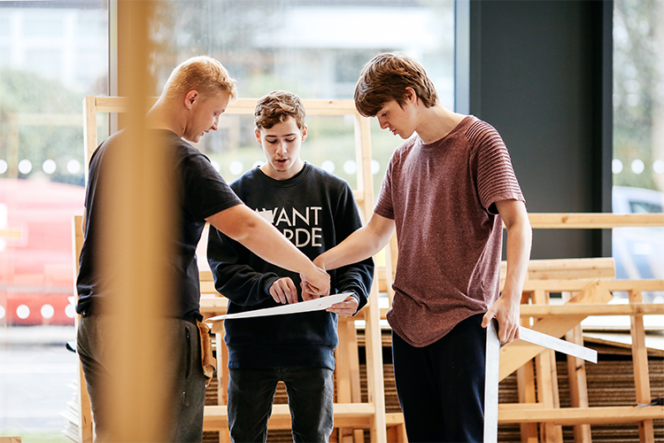 Group of students in a plumbing workshop