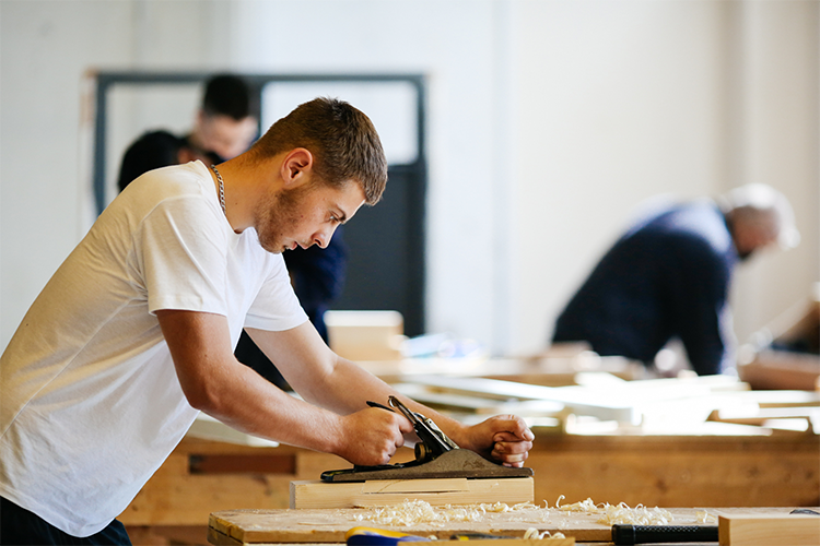 Student in a carpentry workshop