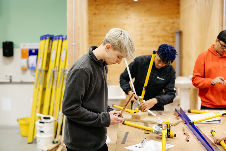 Student working with pipes