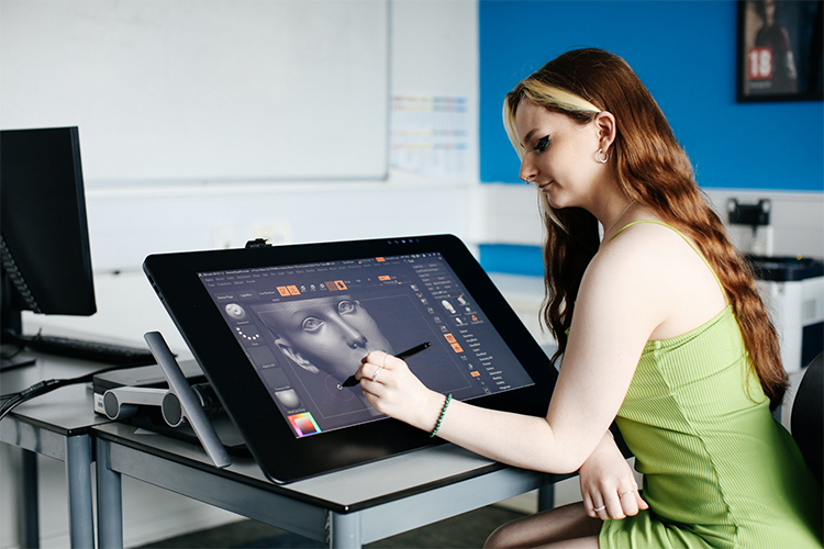 digital gaming student with drawing tablet