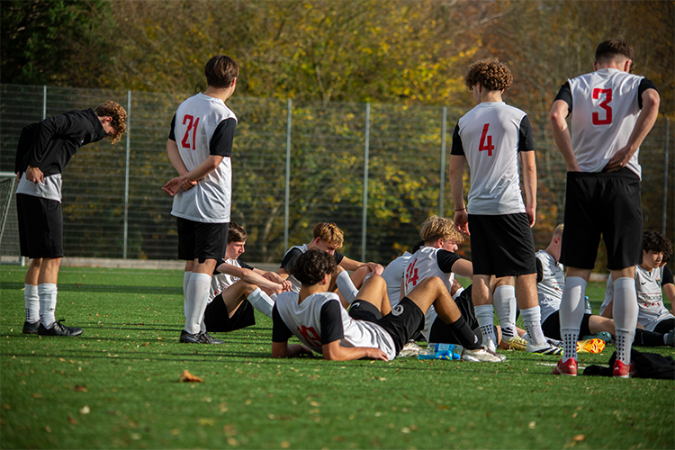 Footballers having a team talk