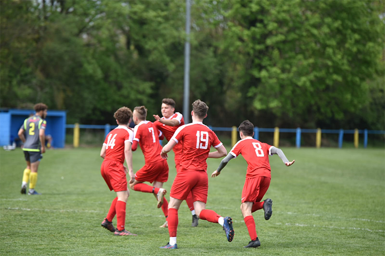 Football Players celebrating a goal