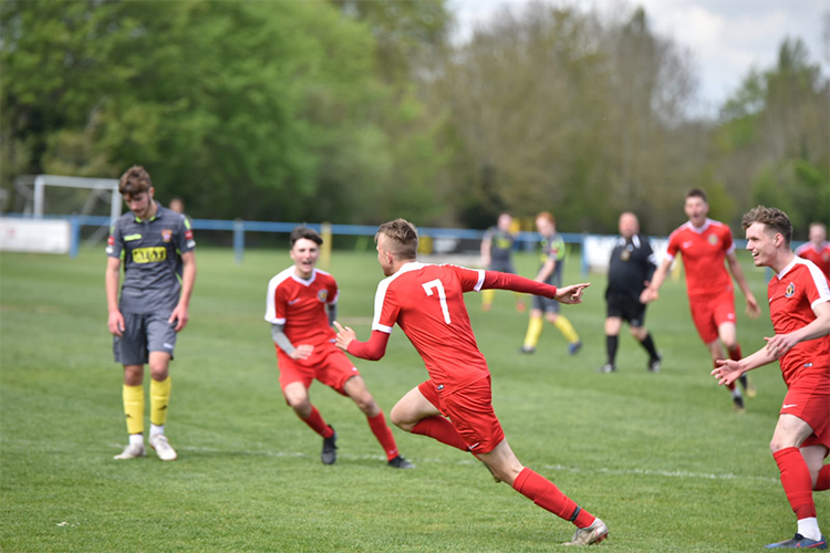 Football Players celebrating a goal