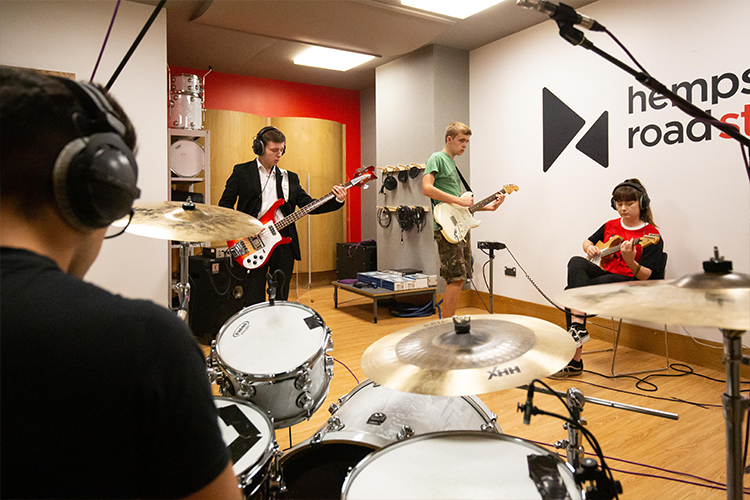 Students playing guitar