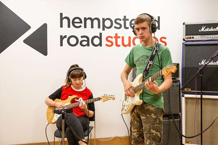 Students playing guitar