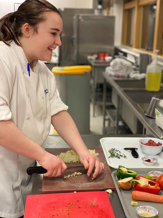 Student chopping food