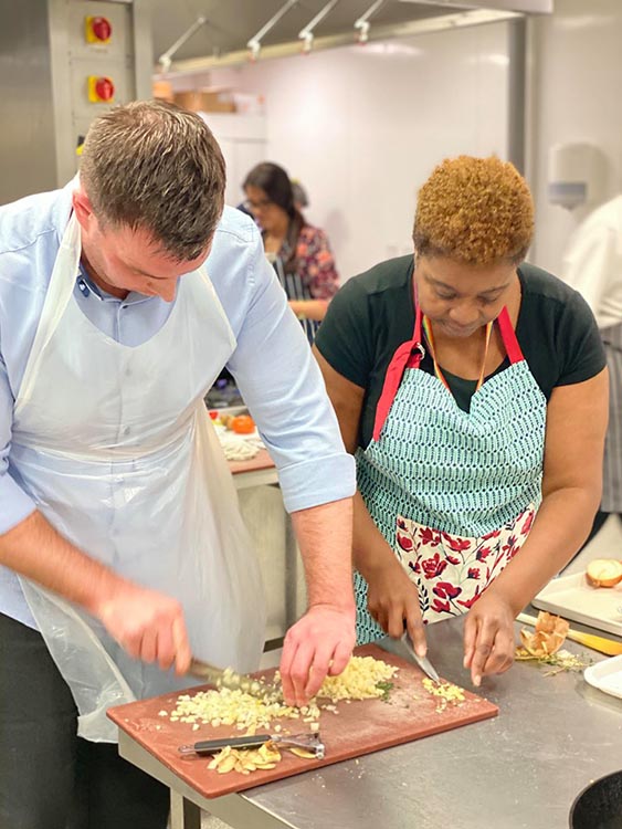 2 students chopping food