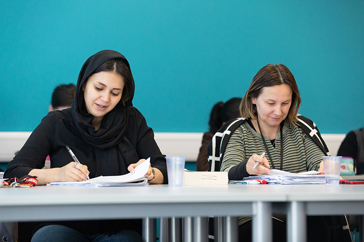 2 students making notes