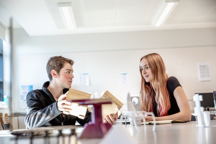 Students looking at 3D Designs