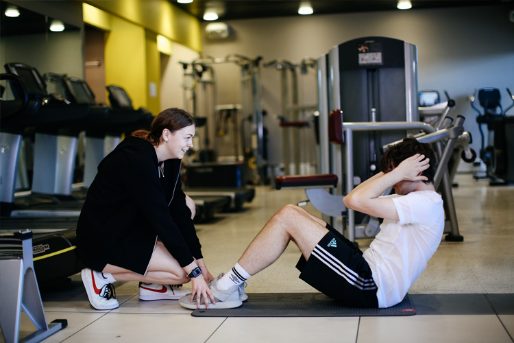 Students doing sit-ups together