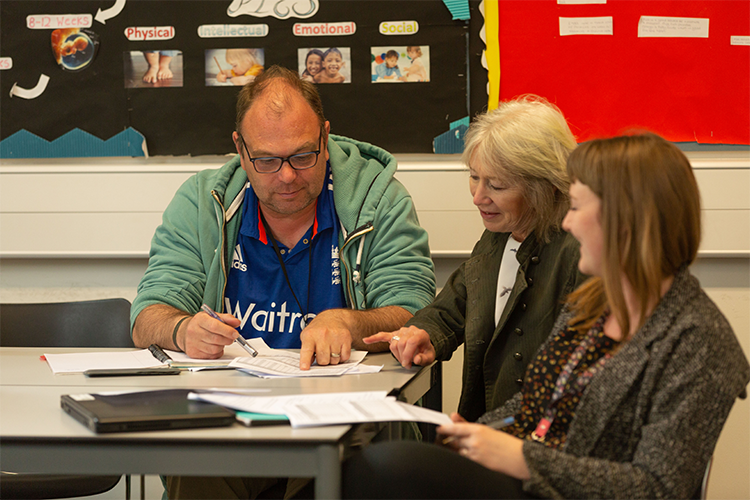 Teacher practicing supporting multiple students