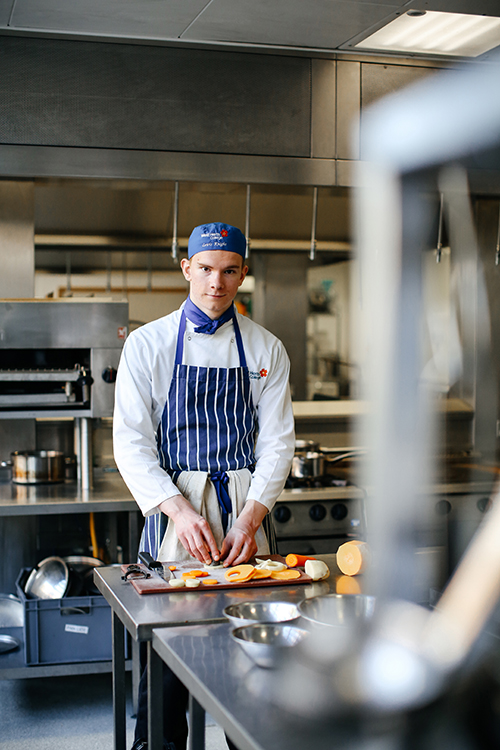 student preparing food