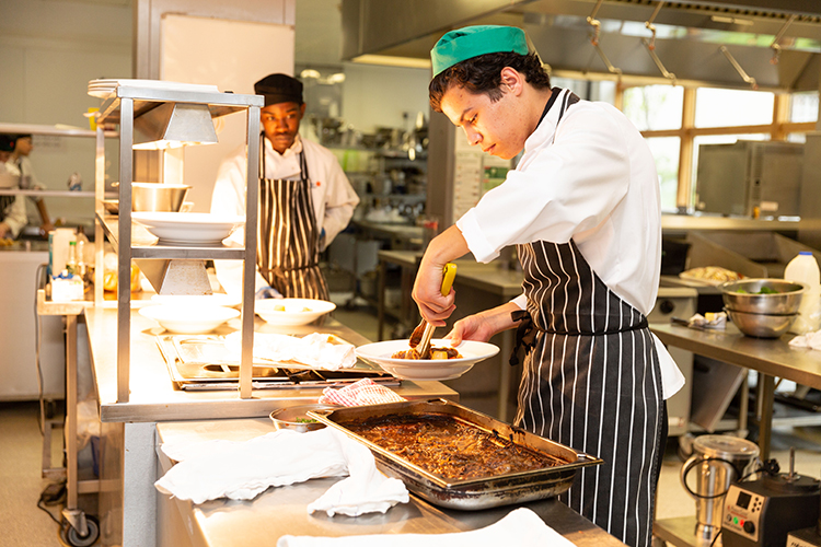 student preparing food