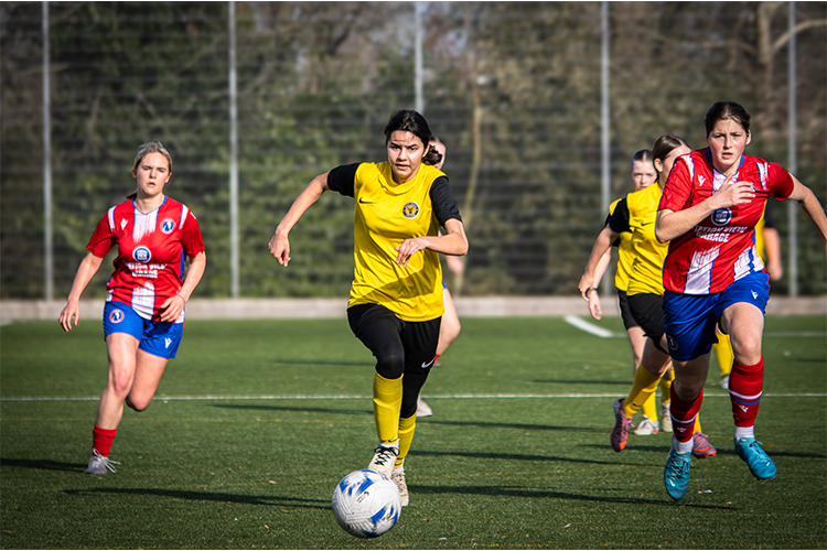 Footballer dribbling