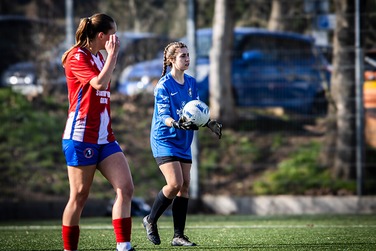 Goalkeeper holding the ball