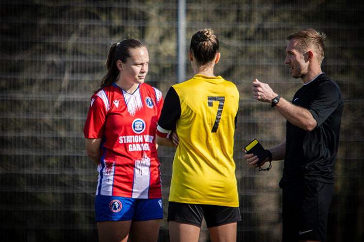 Referee speaking to captains