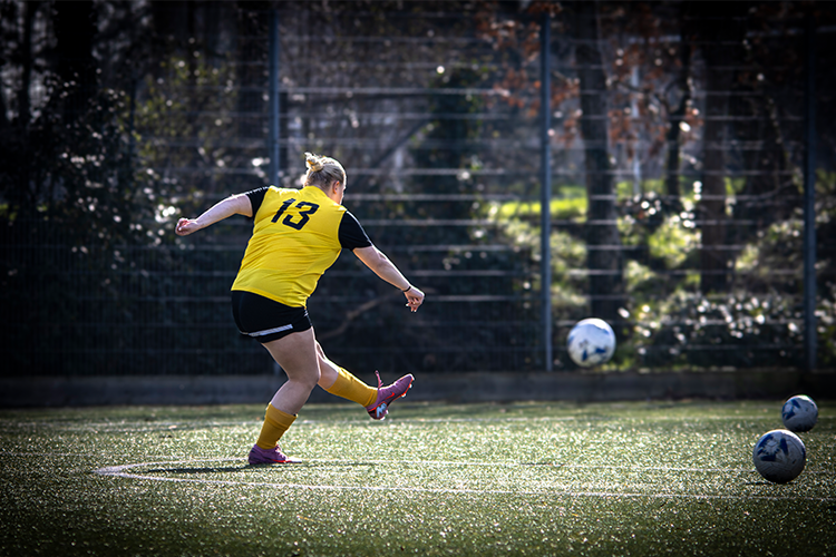 Footballer kicking a ball