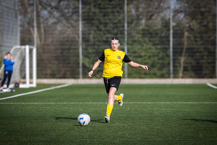 Footballer dribbling