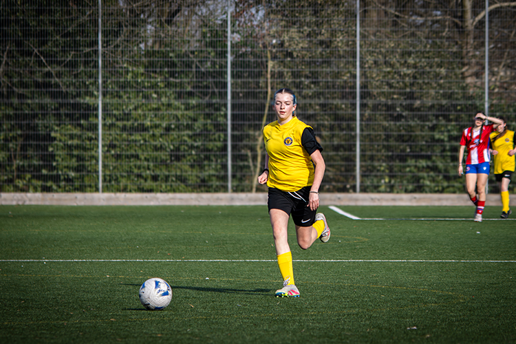 Footballer dribbling