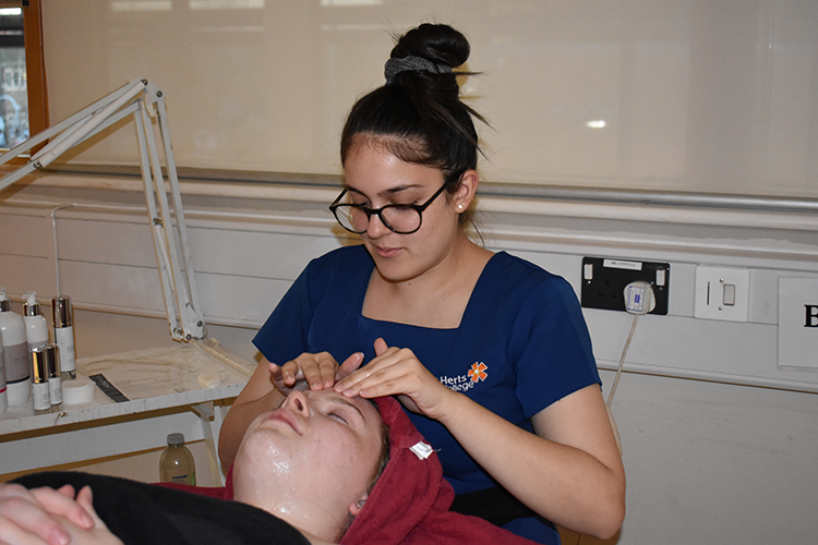 Student giving a facial