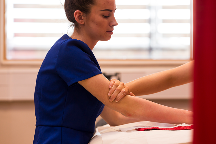 Student having an arm massage