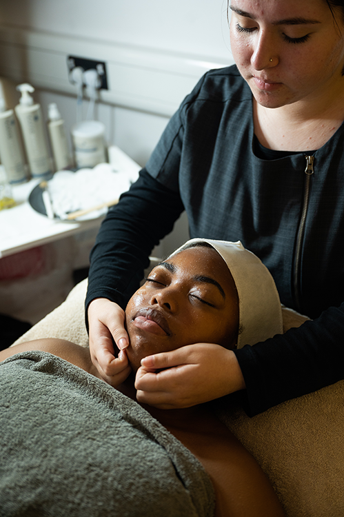 Student giving a facial