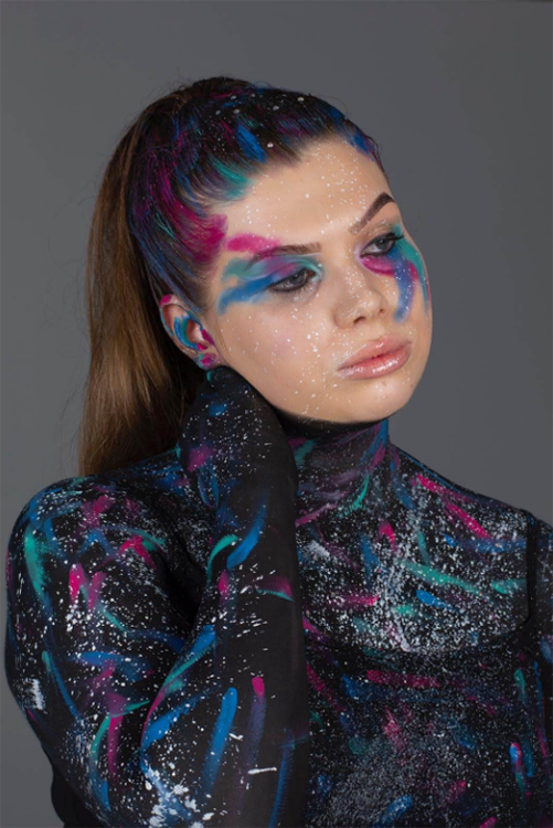 Student with colourful makeup posing
