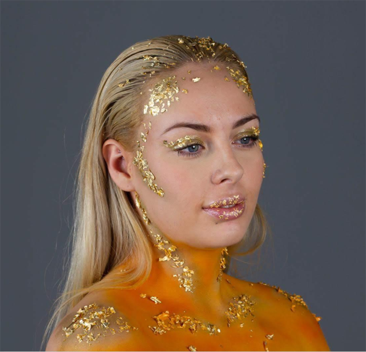 Student with glitter makeup posing