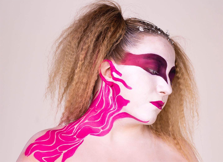 Student with dramatic makeup posing