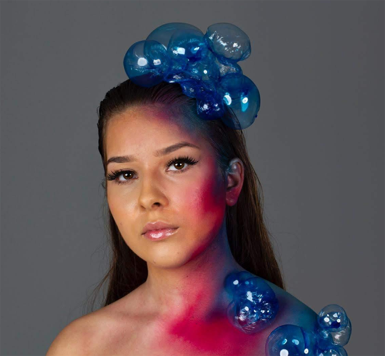 Student with colourful makeup and bubble features posing