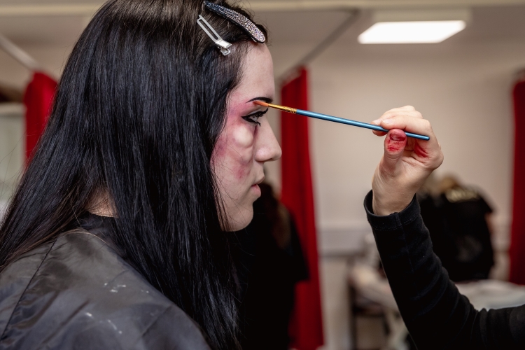 Student working on a hair and media make-up project