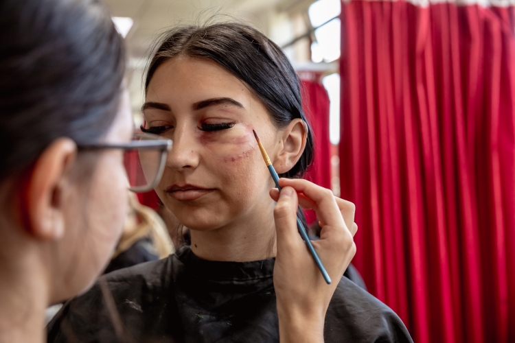 Student working on a hair and media make-up project