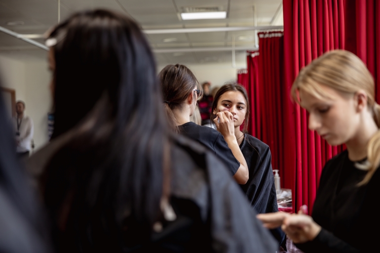 Student working on a hair and media make-up project