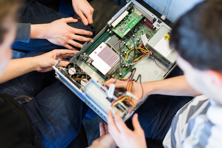 Students looking inside server box