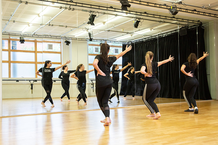 group of students dancing training