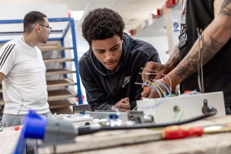 Student looking at wires