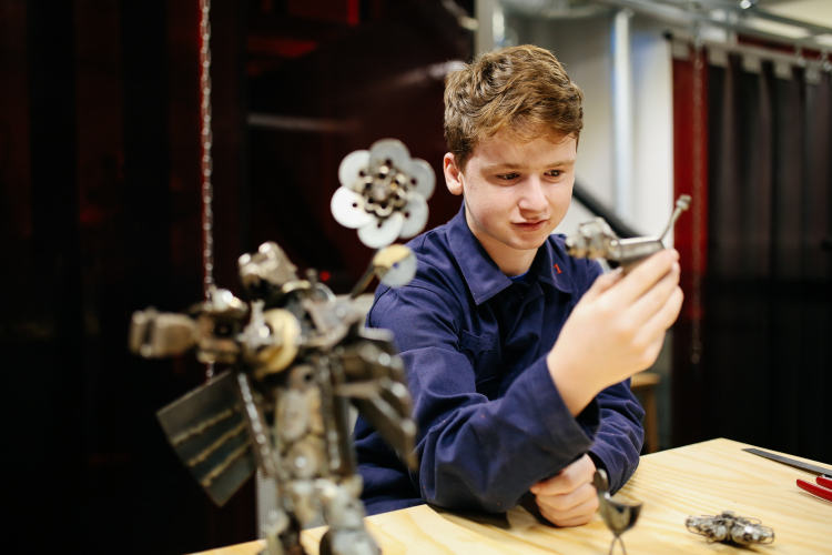 student examining an item