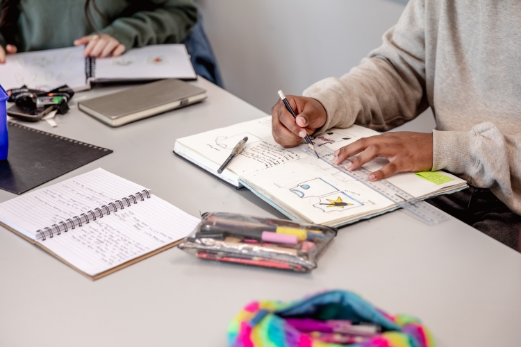 Students working in notebooks