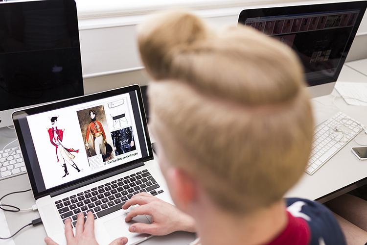 Student researching outfits online