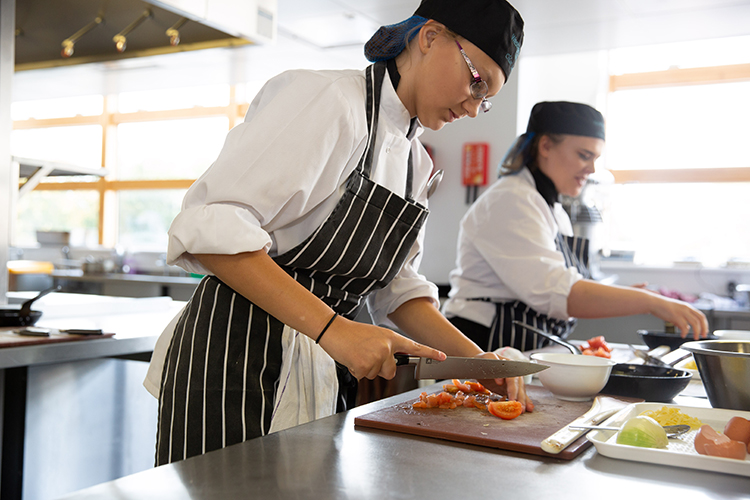 Students chopping food