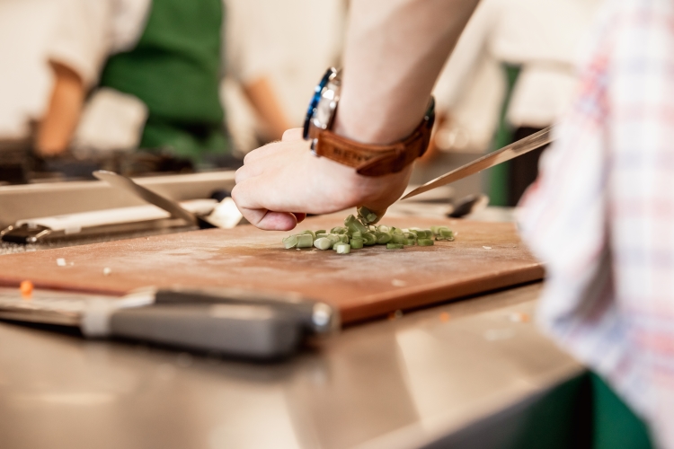 Student cutting food
