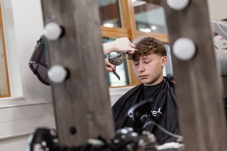 Student working on a barbering project