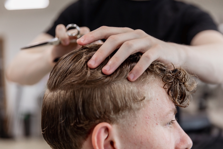 Student working on a barbering project